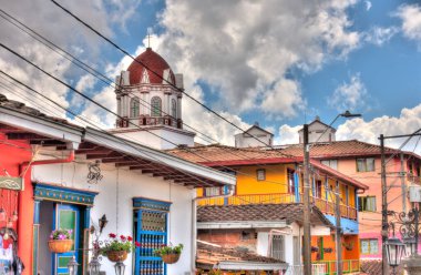Guatape, Antioquia, Colombia - May 2019 : Colorful village in cloudy weather
