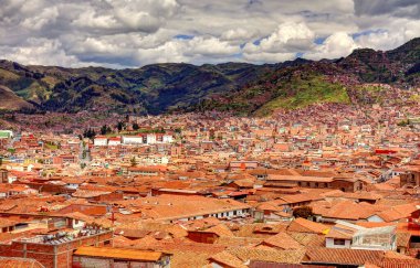 CUSCO, PERU - APRIL 2018: Rooftops of the historical center in cloudy weather