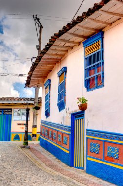 Guatape, Antioquia, Colombia - May 2019 : Colorful village in cloudy weather