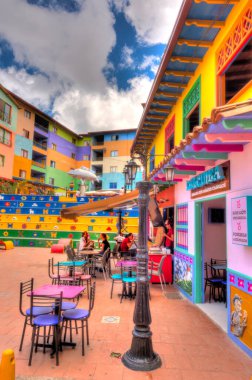 Guatape, Antioquia, Colombia - May 2019 : Colorful village in cloudy weather