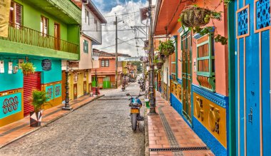 Guatape, Antioquia, Colombia - May 2019 : Colorful village in cloudy weather