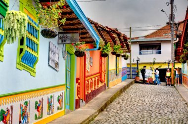 Guatape, Antioquia, Colombia - May 2019 : Colorful village in cloudy weather