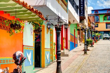 Guatape, Antioquia, Colombia - May 2019 : Colorful village in cloudy weather