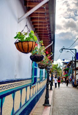 Guatape, Antioquia, Colombia - May 2019 : Colorful village in cloudy weather