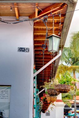 Guatape, Antioquia, Colombia - May 2019 : Colorful village in cloudy weather