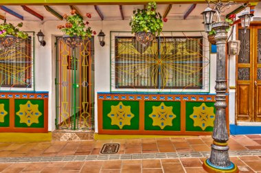 Guatape, Antioquia, Colombia - May 2019 : Colorful village in cloudy weather