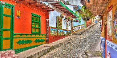 Guatape, Antioquia, Colombia - May 2019 : Colorful village in cloudy weather