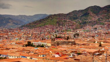 CUSCO, PERU - APRIL 2018: Rooftops of the historical center in cloudy weather
