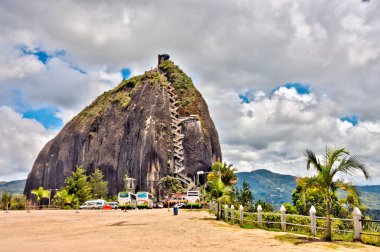Guatape, Colombia - May 2019 : Rock of Guatape in cloudy weather