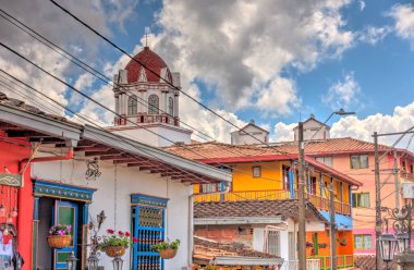 Guatape, Antioquia, Colombia - May 2019 : Colorful village in cloudy weather
