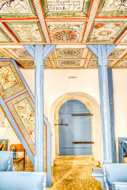  village street and houses in late afternoon lights. Valeni (Magyarvalko), Transylvania, Romania