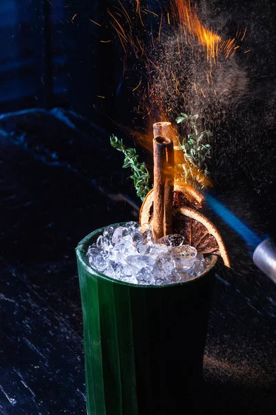 Cocktail preparation with ice and fire