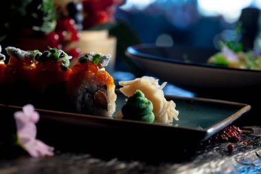 Sushi roll plate on the restaurant table