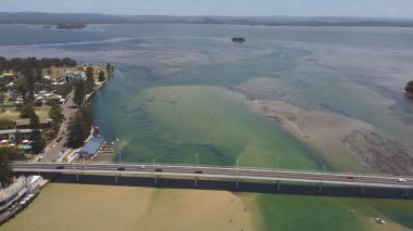 an aerial shot of the entrance bridge at midday during summer on the nsw central coast clipart
