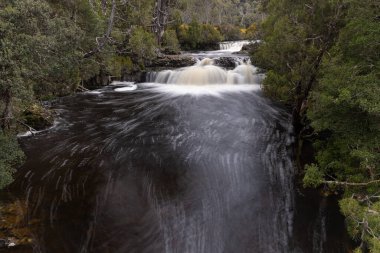 long exposure shot of pencil pine cascade at cradle mountain national park in tasmania, australia