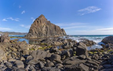 mid afternoon view looking east of lion rock at south cape bay in the wilderness of south west national park in tasmania, australia