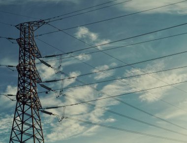 Low angle view of electricity pylon against sky