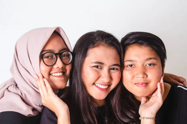 portrait of three young women looking at the camera