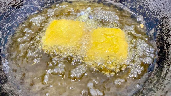 close up of a freshly baked dough with a yellow crust