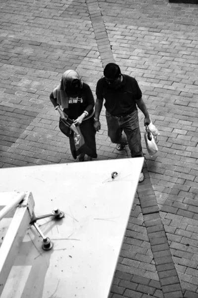 two people walking in the city street