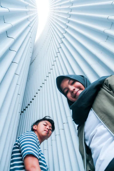 portrait of a young siblings looking to the camera