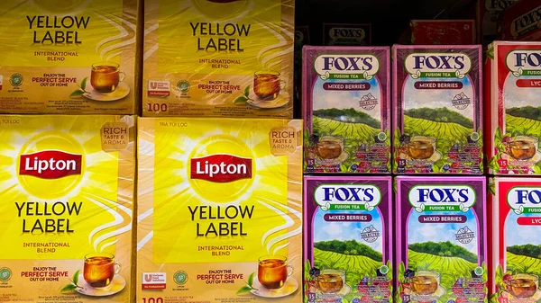 cup of yellow tea boxes in the supermarket