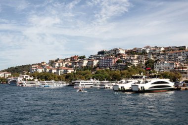 View of moored boats at Uskudar port by Bosphorus in Istanbul. It is sunny summer day.