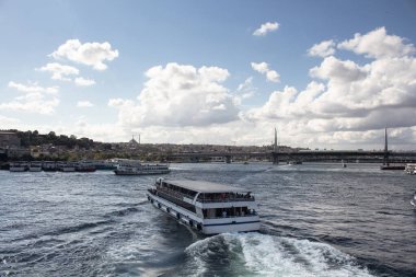 View of tour boats on Golden Horn part of Bosphorus and Halic bridge in Istanbul. It is asunny summer day.