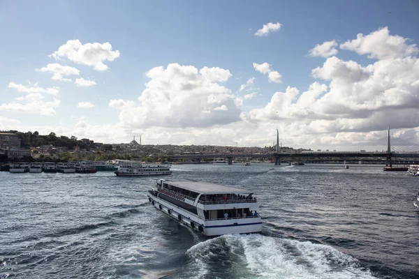 View of tour boats on Golden Horn part of Bosphorus and Halic bridge in Istanbul. It is asunny summer day.