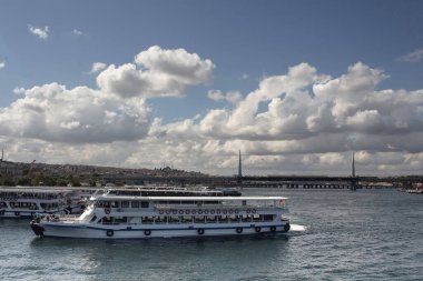 View of tour boats on Golden Horn part of Bosphorus in Istanbul. It is asunny summer day.