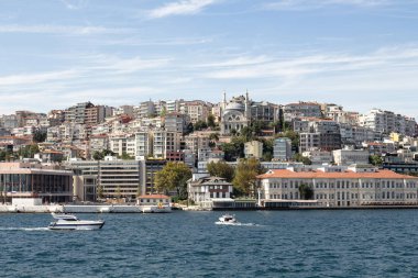 View of a boats on Bosphorus and Gunussuyu area of Beyoglu district in Istanbul. It is a sunny summer day.