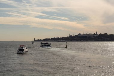 View of cruise tour boats on Bosphorus and Topkapi Palace in Istanbul