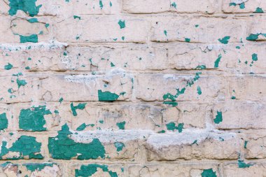 Soyulmuş alçı ve boya ile eski, eski, kirli tuğla duvarın arka planı