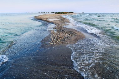 end of the sand spit at sea