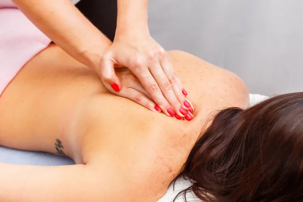 Relaxed Young Woman Lying Face Massage Table Enjoying Therapeutic Body — Foto de Stock