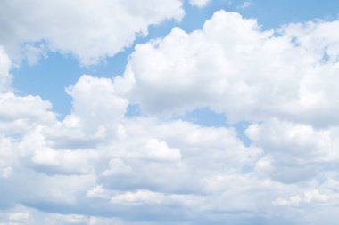 Clouds with blue sky. White cumulus clouds in blue sky at daytime. Natural background photo texture.