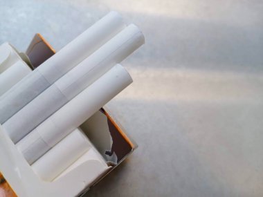 Three butt filters for cigarettes A risk that is difficult to dismiss, with copy space on the right side for text or other.