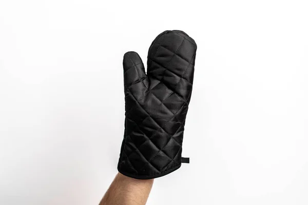 Black oven mitt on a plain white background