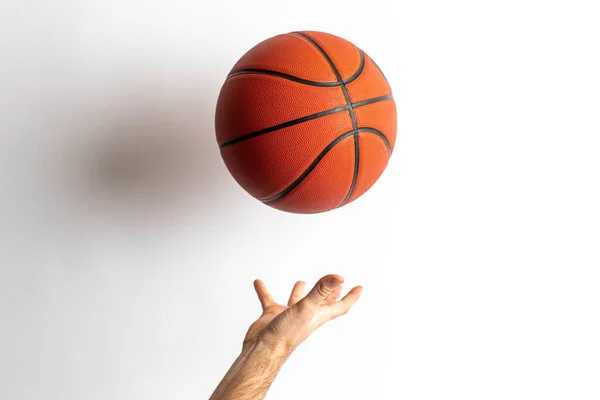 Male Tossing Basketball His Hand White Background — Stok Foto