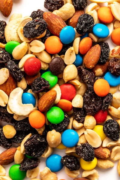 Trail mix including peanuts, almonds, cashews, raisins, and chocolate