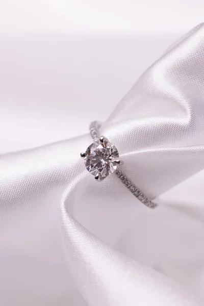 Diamond wedding engagement ring with white fabric