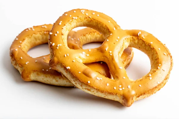 Pretzel with salt on it on a white background