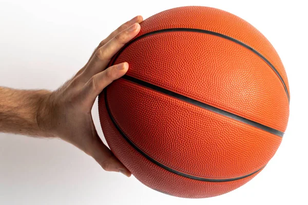 Male holding a basketball in his hand on a white background