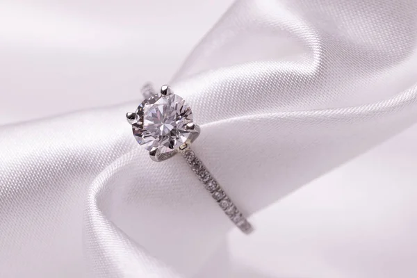 Diamond wedding engagement ring with white fabric