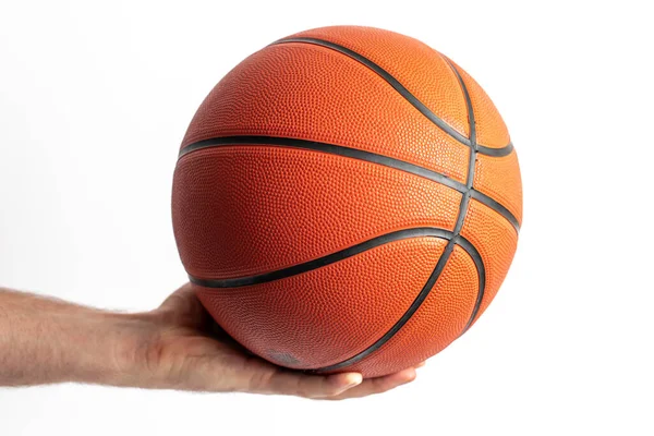 Male holding a basketball in his hand on a white background