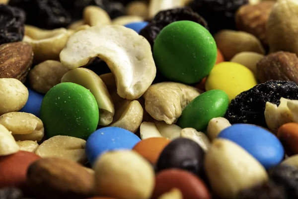 Trail mix including peanuts, almonds, cashews, raisins, and chocolate