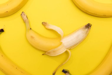 Group of bananas shot on a yellow background
