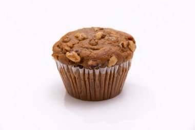 Banana nut muffin shot on a white background