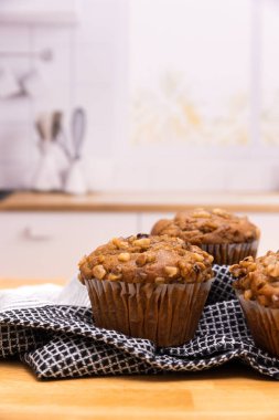Banana nut muffin shot in a kitchen scene