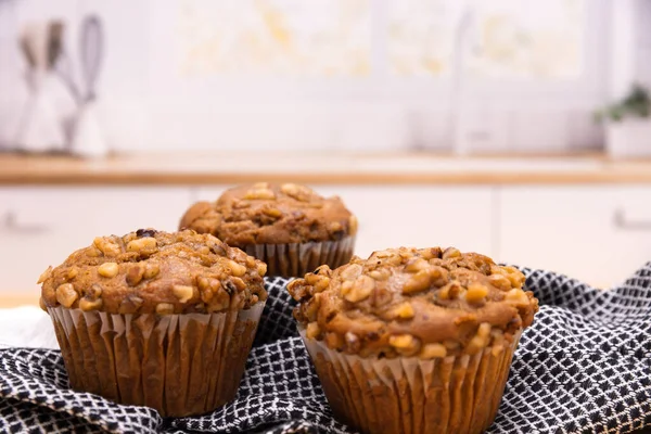 Banana nut muffin shot in a kitchen scene